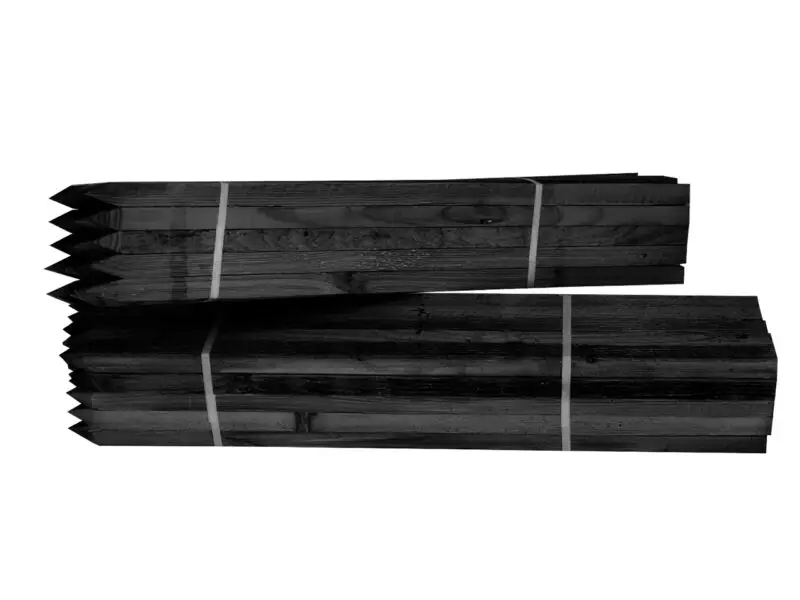 Black treated pine stakes stacked