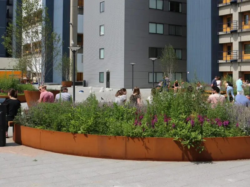 Corten curved retaining wall | Archipello.